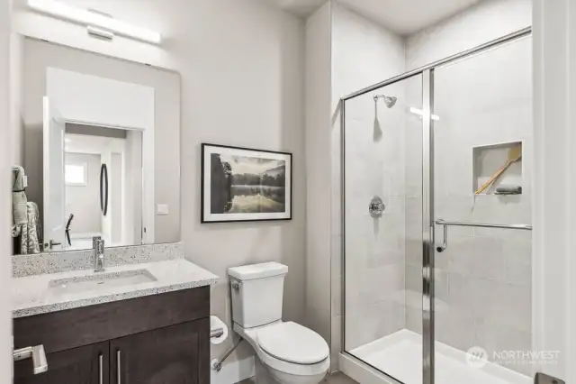 Main floor bathroom with Shower. Photos are for representational purposes only.  Colors and options may vary.