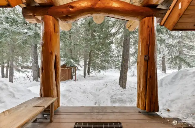 Delightful curved logs grace the entry