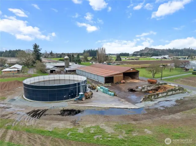 View of the farm from the North. Multiple barns & a Slurrystore manure storage
