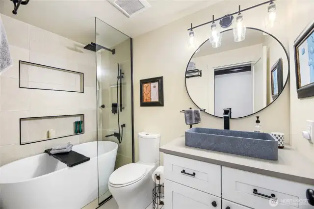 Renovated 'shower room' full bath with all new fixtures and cabinetry! Sleek!
