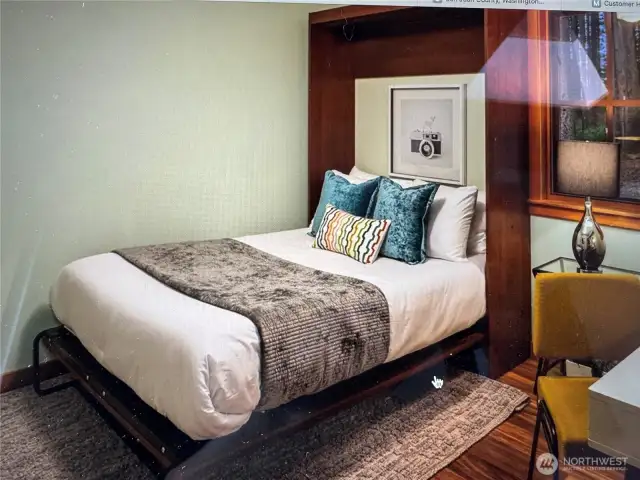 Murphy bed in one of two main floor bedrooms allows for flexible use of space.