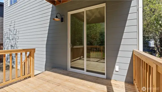 Deck has stair access to backyard.
