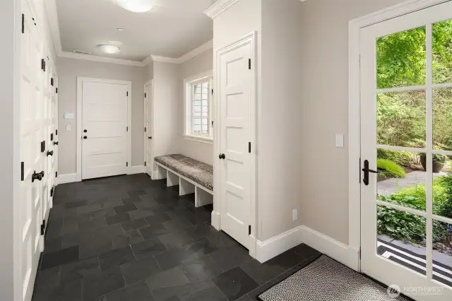 Mudroom with 3 distinct closet systems plus entry closet!
