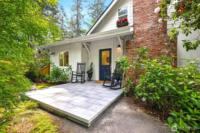 Beautiful stone front porch is perfect for sitting and enjoying the beauty of the property!