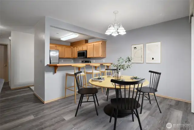 New LVP flooring installed through the living room, dining area and hallways.  Dining area is virtually staged.