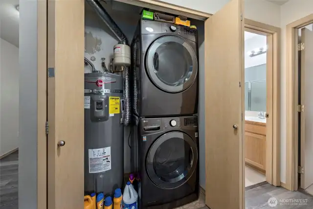 Laundry closet with brand new water heater.