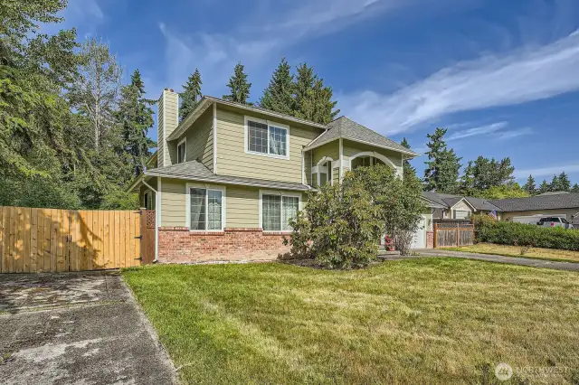 Side driveway parking with gate entering backyard
