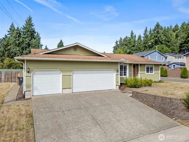Three car garage + tons of driveway parking.