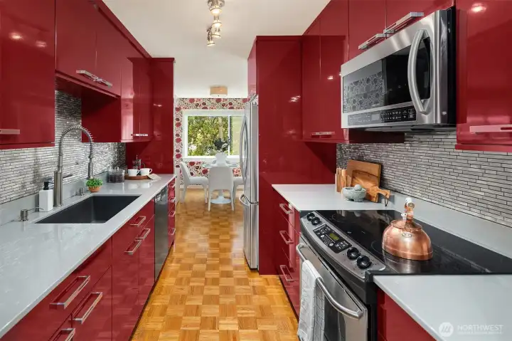 Completely remodeled kitchen with custom cabinetry, lots of storage, beautiful tilework and gleaming countertops