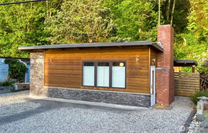 This cute beach bungalow backs a gorgeous treed hillside. 2 bedroom/1 bath bungalow fully renovated from 2018-2021 and is located across the street from McKee's Beach! Just 2 doors from the beach access and a few doors the other direction from the boat launch! Comes fully furnished (minus the staging) and Short-Term Rentals are allowed!