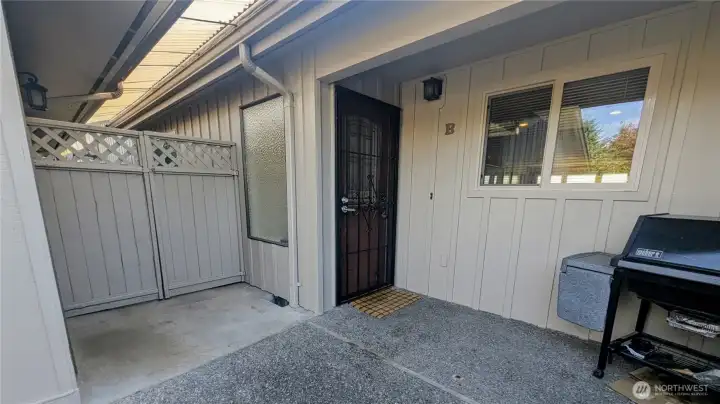 Front door entrance.  Garage door to the left.