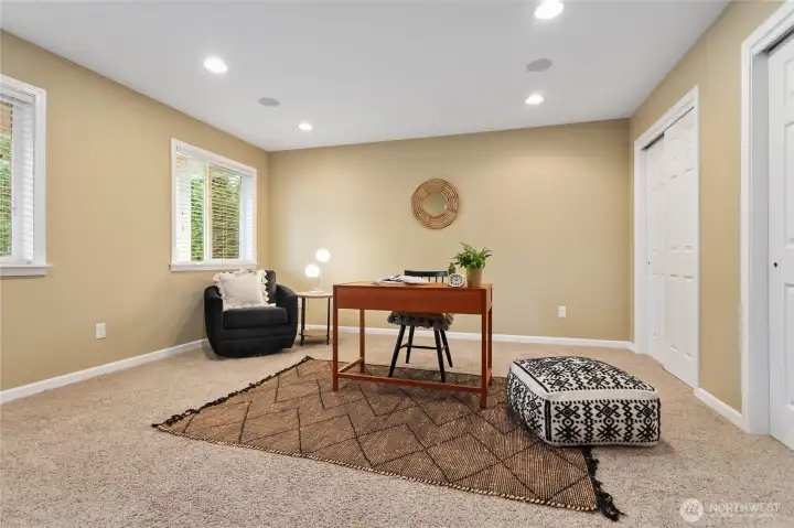 Generous sized flex space off the entrance lives as a den, office or fourth bedroom with pocket doors that slide closed for privacy