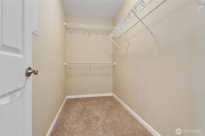Walk-in primary bedroom closet