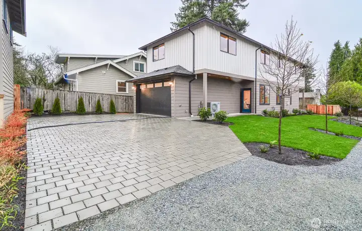Separate paver block driveway.