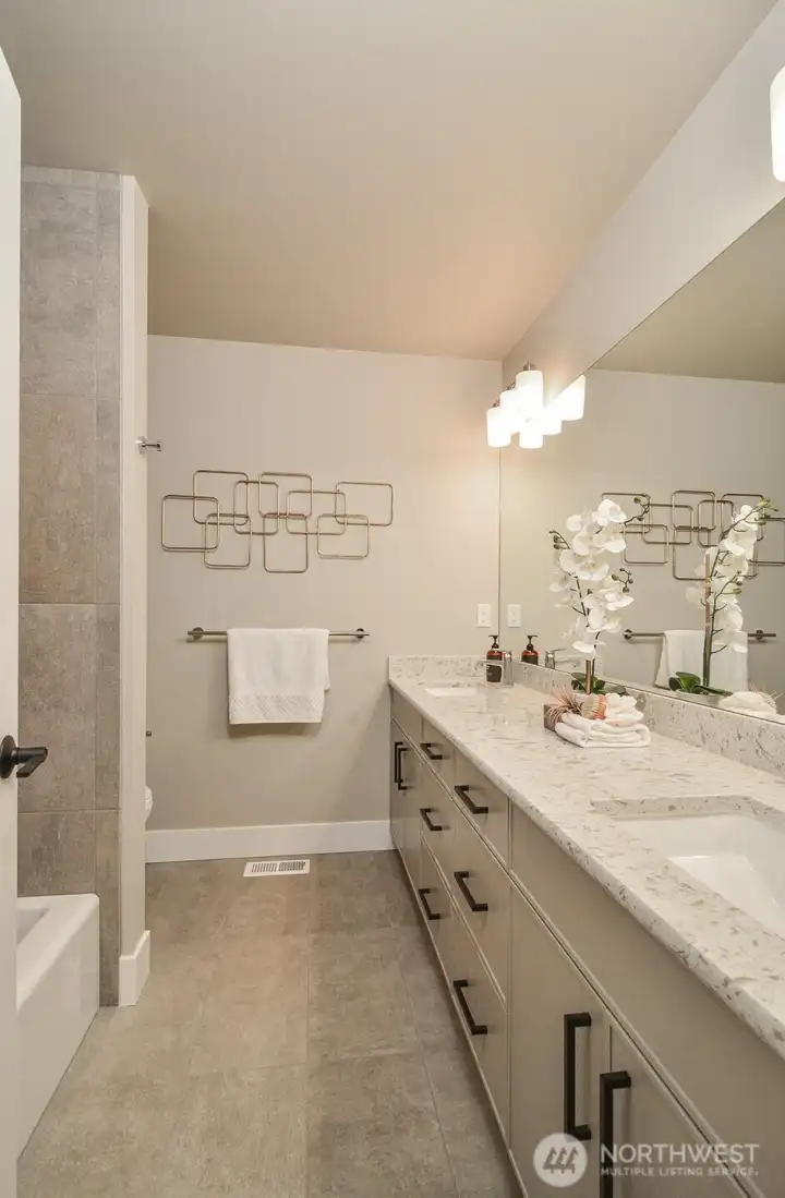 Upper level bathroom with double vanity.