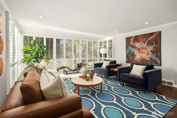 It's hard to overstate the scale of this spectacular room.  The chairs and sofa are large pieces, well-spaced, with ample room for a chaise to boot.