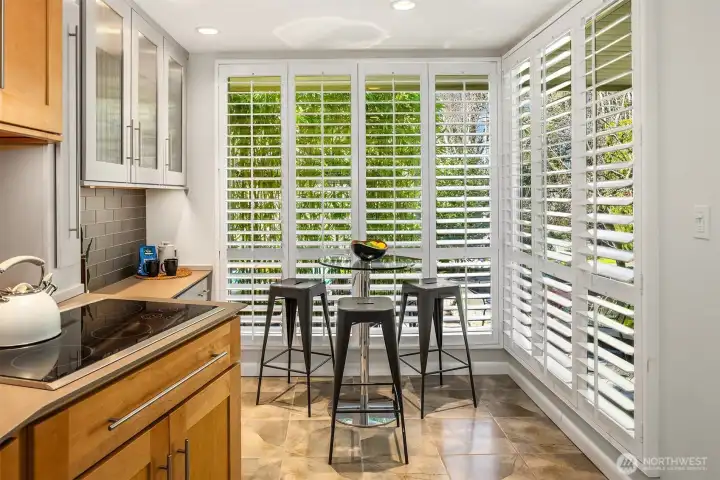 This eating nook with storage and counter (coffee bar??) looks out upon the front patio, and offers a perfect perch for banging out emails on your laptop or quietly musing about how good life is.