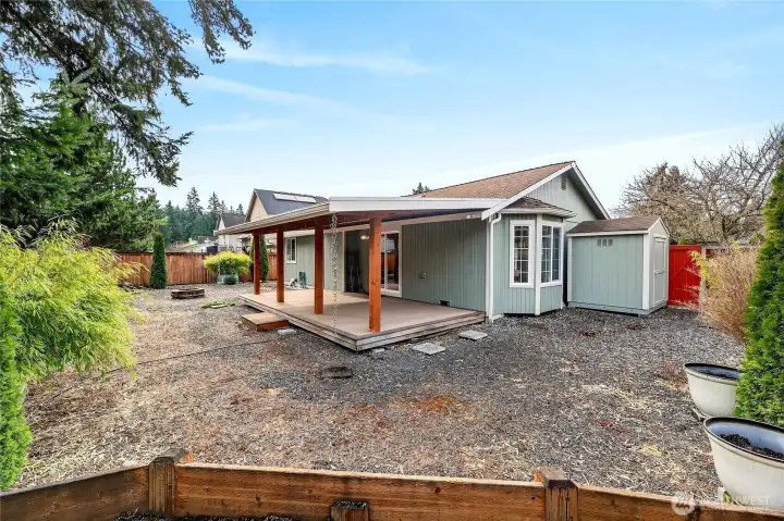 Covered rear Trex deck with lifetime roof.