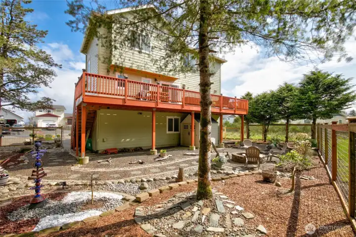 The back yard is a creatively designed and tranquil setting.