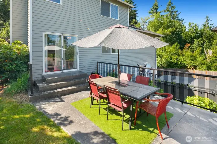 Expansive back yard w/ outdoor kitchen, multiple entertaining areas, Swim Spa & garden beds