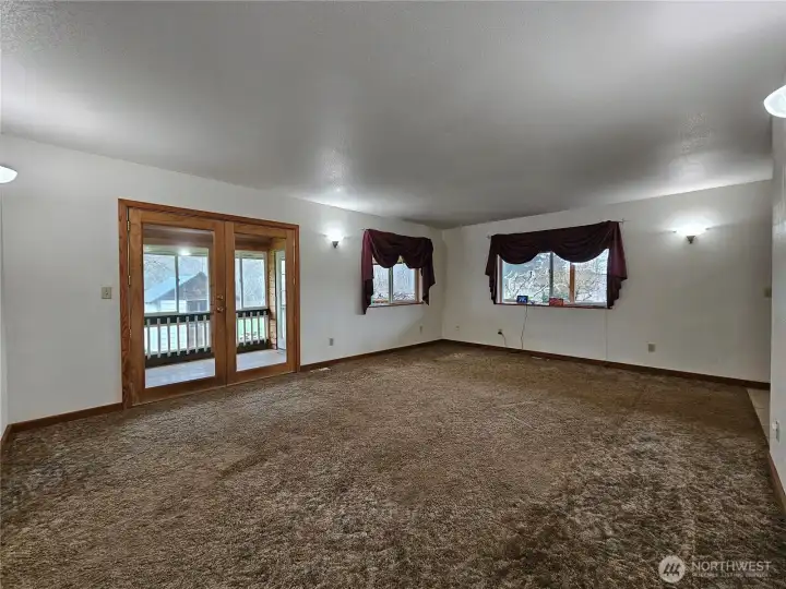 Living Room with French Doors to the Enclosed Sun Porch