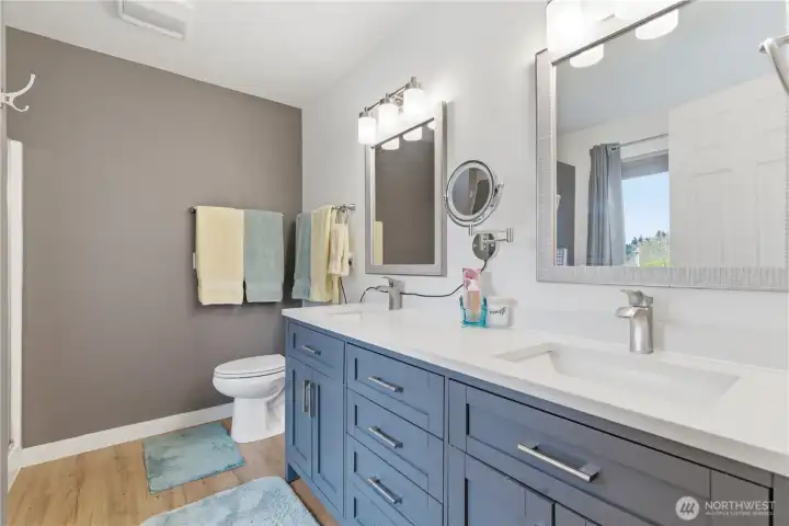 Updated bathroom with a dual-sink vanity for added convenience