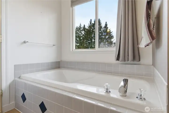 Relaxing tub set by a window for soft natural light