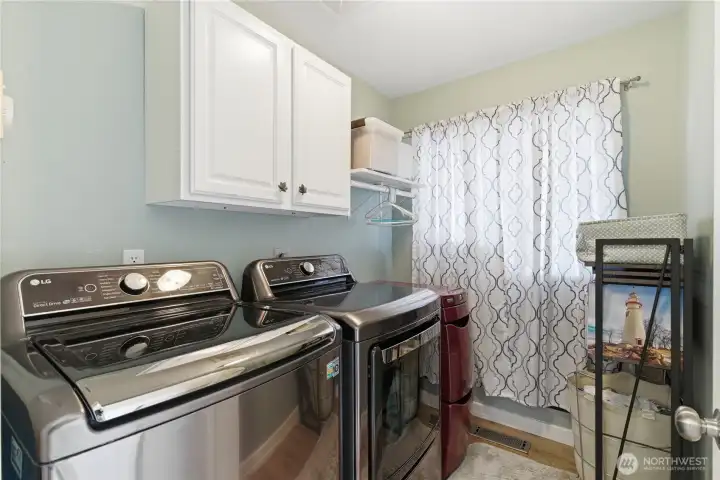 Laundry area on the garage level, keeping it separate from main living