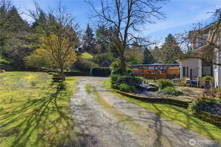 Private driveway leads to the home, creating a more intentional and peaceful sense of privacy-RV parking shown to the left