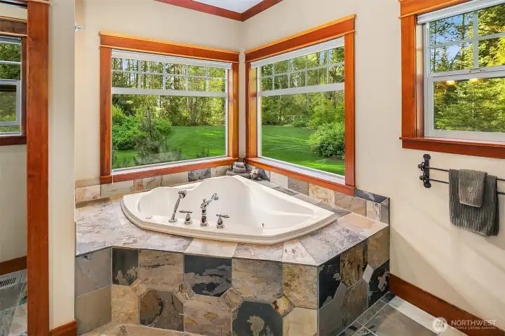 Large garden, jetted soaking tub, just add bubbles and drift away while looking out into your backyard oasis.