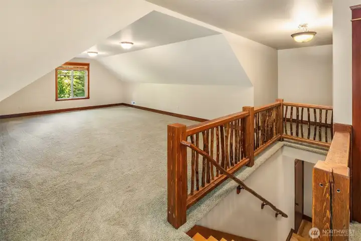 2nd floor bonus room, so many options here, there is also a bedroom and bathroom on 2nd floor for additional family or guest rooms. The railing and handrail are made from trees that were on the property.