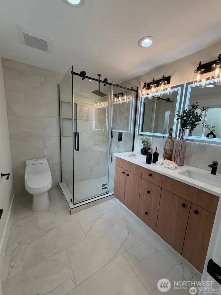 Master bath with double vanity and shower