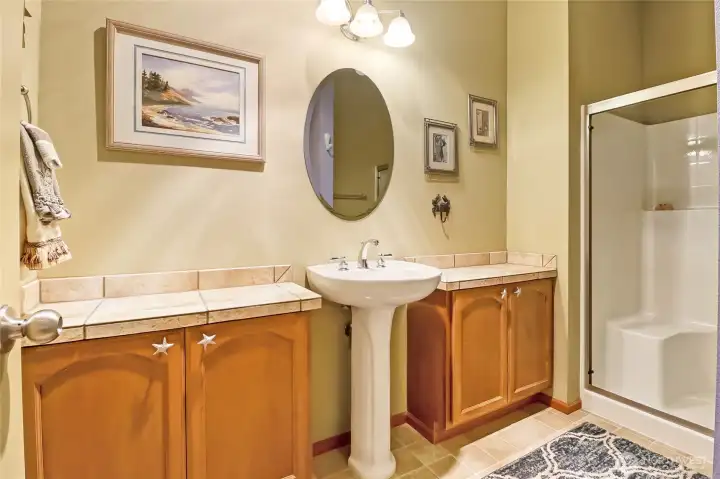 Bathroom with shower just across the hall from the main-floor bedroom.