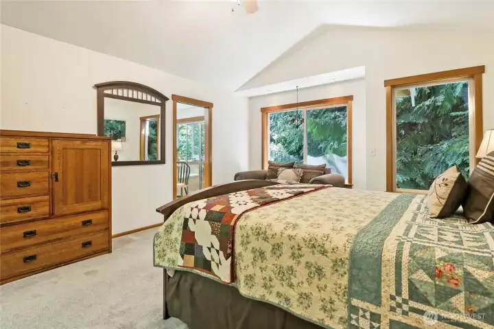Vaulted ceiling and a breezy ceiling fan for summertime.