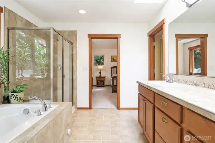 Separate walk-in shower & beautiful tile work throughout.