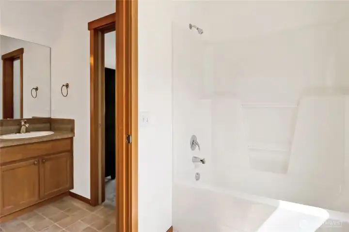 Separate room for the bathtub/shower & commode provides space & privacy during the morning rush.