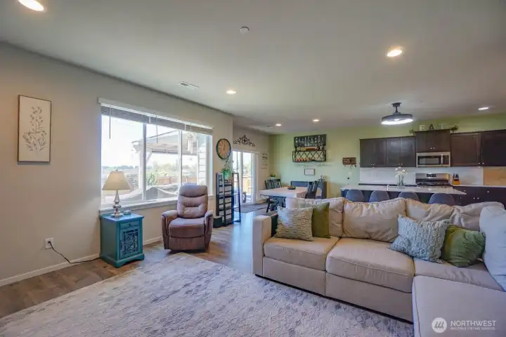 Family room into kitchen and dining room with sliding glass door to the rear deck for easy entertaining Family room into kitchen and dining room with sliding glass door to the rear deck for easy entertaining