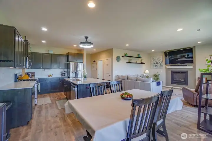 Dining area into kitchen with ss appliances and large island with seating area Dining area into kitchen with ss appliances and large island with seating area
