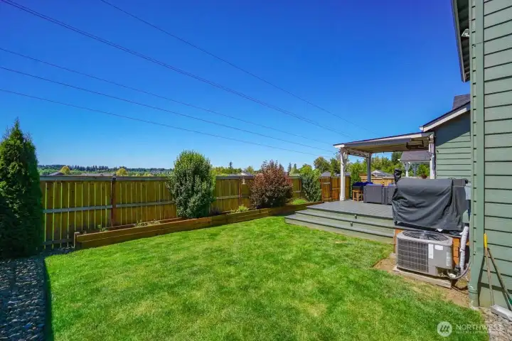 Fully fenced backyard offers privacy and convenient gate access to the public park Fully fenced backyard offers privacy and convenient gate access to the public park