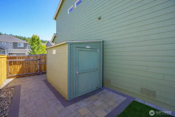 Side patio with outdoor shed for additional storage Side patio with outdoor shed for additional storage