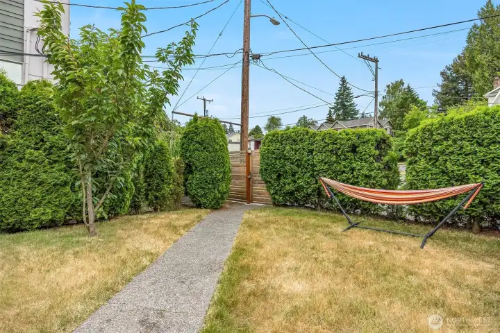 Not your typical townhouse! Cute, sunny front yard and entry!