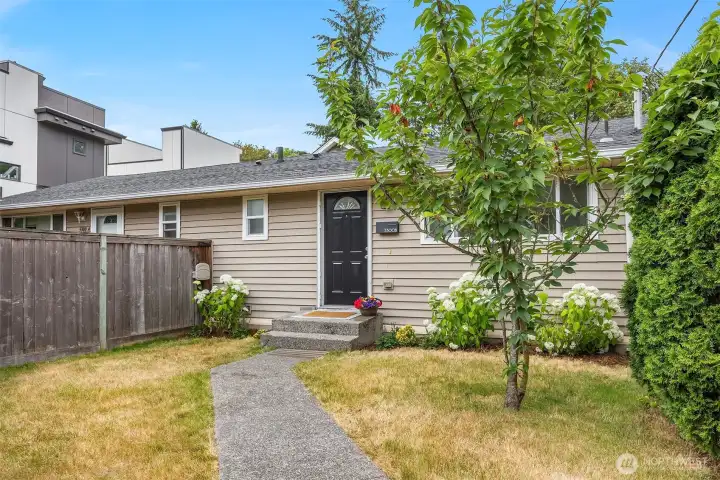 Not your typical townhouse! Cute, sunny front yard and entry!