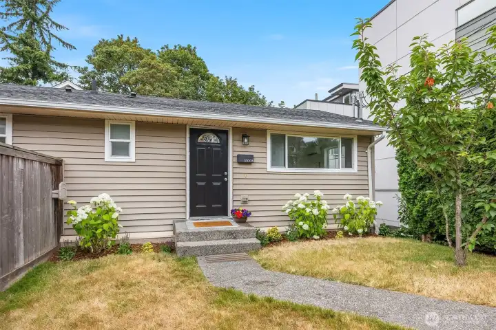 Not your typical townhouse! Cute, sunny front yard and entry!