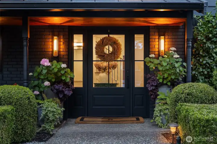 Welcome home! Covered elegant front entrance with curated lighting welcomes you and your guests. Welcome home! Covered elegant front entrance with curated lighting welcomes you and your guests.