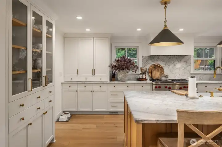 Custom cabinets galore, plus a Wolf 6-burner range & double ovens. Custom cabinets galore, plus a Wolf 6-burner range & double ovens.