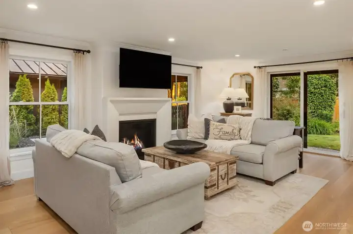 Relax around the fireside in the open family room with a slider opening to the back yard. Relax around the fireside in the open family room with a slider opening to the back yard.