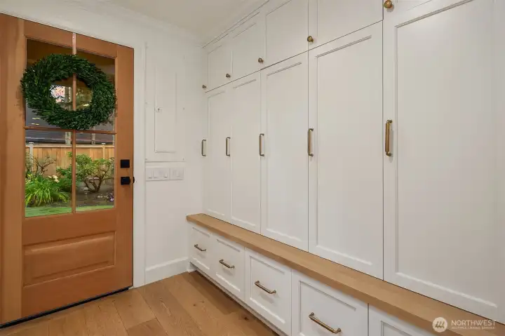 Custom cabinets in the mud room keep shoes & accessories organized & out of sight. Custom cabinets in the mud room keep shoes & accessories organized & out of sight.