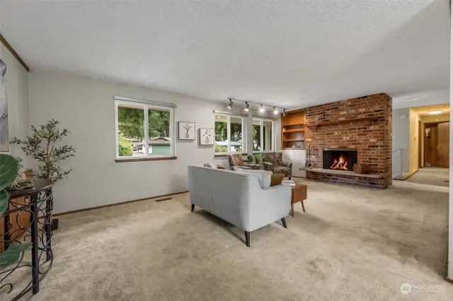 Living room has a wood burning fireplace