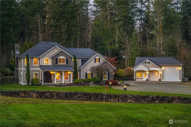 Set near  the Cascade Mountains, this luxurious private home is  nearly 5 acres of lush grounds and lawns that include a  sprinkler system and pitching field range for the golfer.