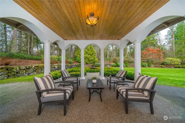 Step outside French doors to a large covered patio  with a distinctive wood columned design: sip a cool  beverage on a hot day as you look out over the  manicured grounds and water fountain – you’ll think  you were in Italy from this beautiful vantage!